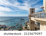 Elevador Lacerda (elevator) and Todos os Santos Bay on a sunny summer day at Salvador, Bahia. Historic architecture in Brazil