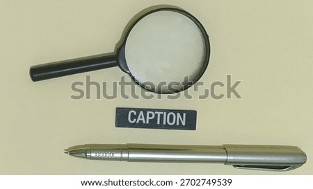 Elevate your captions with creative tools. Magnifying glass enhances clarity and focus, while a pen adds precision to crafting impactful content.