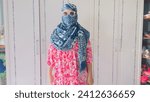 Elevate your visual narrative with this striking Shutterstock image featuring a high face cover, seamlessly blending fashion and functionality in the contemporary world. The photograph captures a capt