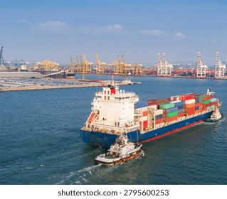 Elevated drone view from behind a fully loaded container ship as it departs port and heads toward open waters, accompanied by escort vessels. The scene highlights global trade, maritime logistics, international shipping, and freight transportation, showcasing the immense scale of modern cargo operations and ocean commerce.