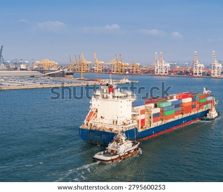 Elevated drone view from behind a fully loaded container ship as it departs port and heads toward open waters, accompanied by escort vessels. The scene highlights global trade, maritime logistics, international shipping, and freight transportation, showcasing the immense scale of modern cargo operations and ocean commerce.