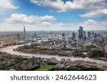 Elevated panorama of the London skyline along the river Thames from London Bridge until the City during a sunny summer day, United Kingdom 