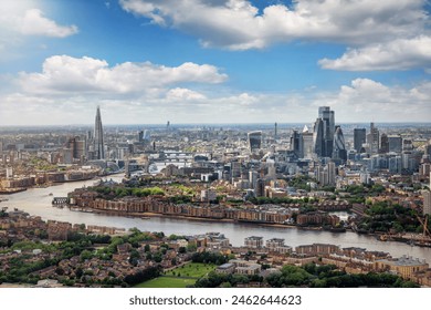 Elevated panorama of the London skyline along the river Thames from London Bridge until the City during a sunny summer day, United Kingdom  - Powered by Shutterstock