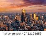 Elevated, panoramic view of the urban skyline of the skyscrapers at the City of London during a colorful sunrise, England