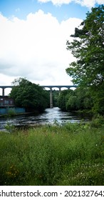 Elevated Pontcysyllte Aqueduct, as seen from a distance in nature. It is the highest canal aqueduct in the world. Portrait orientation photo.