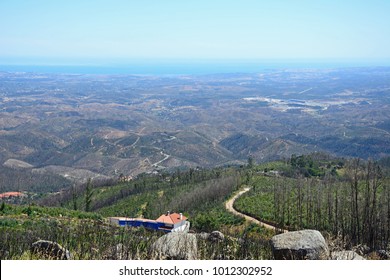 Elevated view across the Monchique mountains and countryside towards the coastline, Monchique, Algarve, Portugal, Europe.