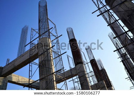 An elevated view of the  building under construction that has a sky background.