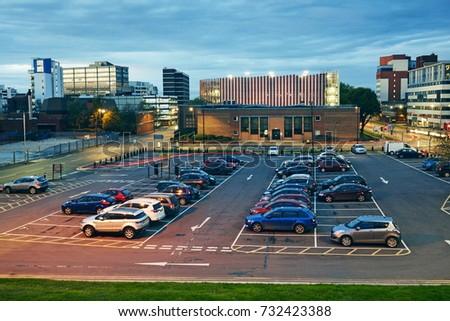Elevated view of car park in the redeveloped office area of Swindon illuminated at dusk