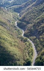 Elevated view of empty road through the mountains 