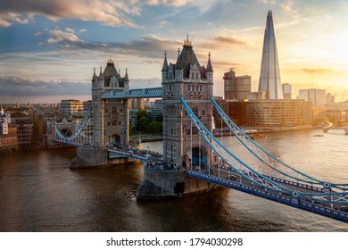 Elevated view of the famous Tower Bridge and skyline of London, UK, during beautiful sunset time in summer - Shutterstock ID 1794030298