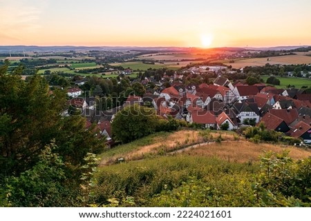Elevated view of the half-timbered houses of Schwalenberg village in warm evening light, Teutoburg Forest, Germany