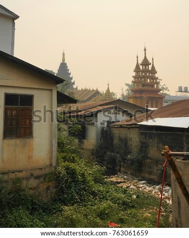 An elevated view of homes and temples in the town of Tachileik, in the Republic of Myanmar (Burma).