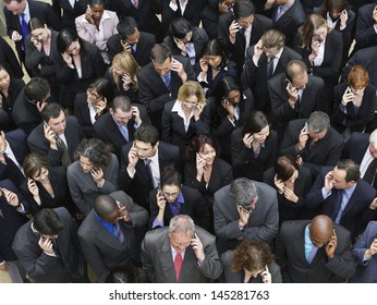 Elevated View Of Large Group Of Business People Using Mobile Phones 