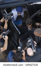 Elevated View Of Paparazzi Around Male Celebrity