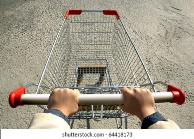 An Elevated View Of A Single Empty Shopping-cart