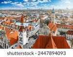 Elevated view of the skyline of Munich, Germany, with the old townhall and Heilig Geist church during a sunny day