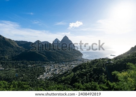 An elevated view of the small town of Soufriere in St Lucia with the twin Pitons in the background.