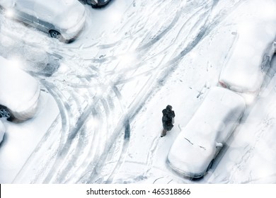 Elevated View Of Snow Covered Parking Lot.