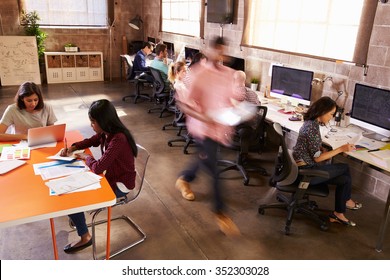 Elevated View Of Workers In Busy Modern Design Office