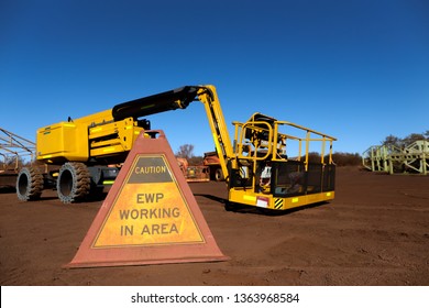 Elevated Work Platform Caution Warning Triangle Sign Placing On The Ground At Construction Site Perth, Australia 