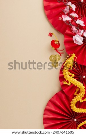 Elevating the ambiance with grandeur to welcome Chinese New Year. Top view vertical shot of red folding fans, sakura, gold dragon, lanterns, gold coins, on beige background with promo spot