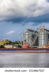 Elevating complex for transshipment of grain and oilseeds as part of a reloading terminal. Transportation of agricultural products and port cranes - Image