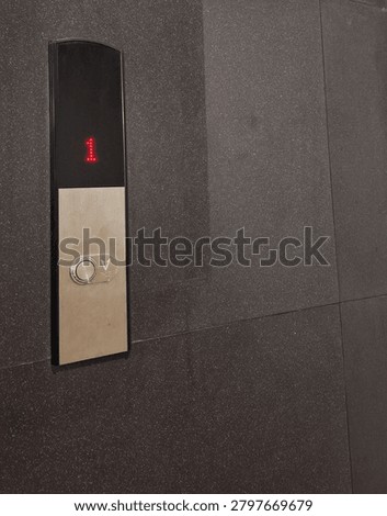 The elevator button that must be pressed before we use it