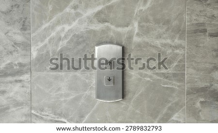 Elevator Call Panel on Gray Marble Wal