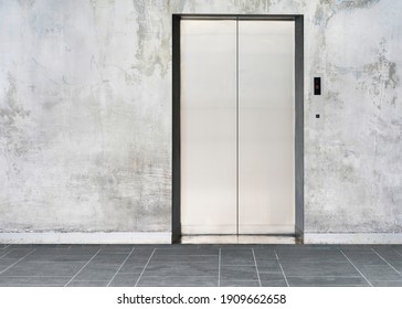 elevator with closed door with wall background