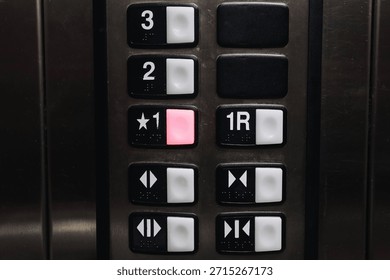Elevator control panel closeup. Floor selection buttons inside lift. Modern building interior detail. Transportation technology concept. Vertical mobility system indoors. Public infrastructure design.