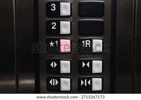 Elevator control panel closeup. Floor selection buttons inside lift. Modern building interior detail. Transportation technology concept. Vertical mobility system indoors. Public infrastructure design.