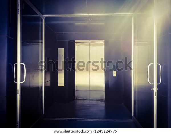 Elevator Doors Sunlight Shining Down Buildings Landmarks