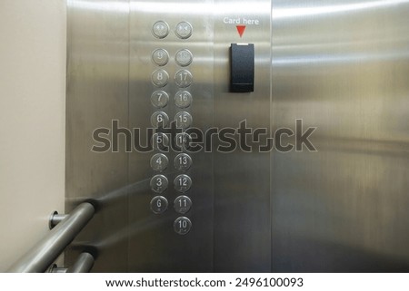 The elevator has a card reader on the wall. The buttons are numbered from 1 to 10