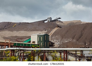 Elevator On The Mountain Of Waste, Throwing Out Waste Rock. Mining And Slag. Industrial Landscape
