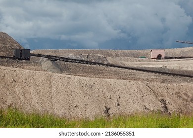 Elevator On The Mountain Of Waste, Throwing Out Waste Rock. Mining And Slag. Industrial Landscape
