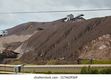 Elevator On The Mountain Of Waste, Throwing Out Waste Rock. Mining And Slag. Industrial Landscape
