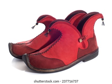 Elf Shoes In Front Of White Background