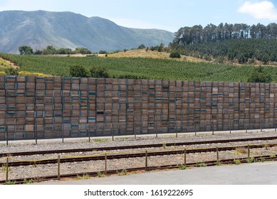 Elgin, Western Cape, South Africa. December 2019. Boxes Stacked At A Fruit Packing Station Alongside The Railway In Elgin, South Africa.