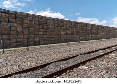 Elgin, Western Cape, South Africa. December 2019. Boxes Stacked At A Fruit Packing Station Alongside The Railway In Elgin, South Africa.