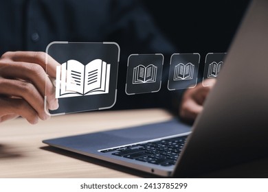 E-library concept. Person use laptop with virtual E-book icons for electronic books online, knowledge base on internet, digital library or e-library.