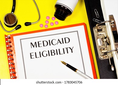 Eligibility For Medicaid - Text Inscription On The Form On The Medical Folder. A Federal-state Health Insurance Program Designed For Low-income Residents. 