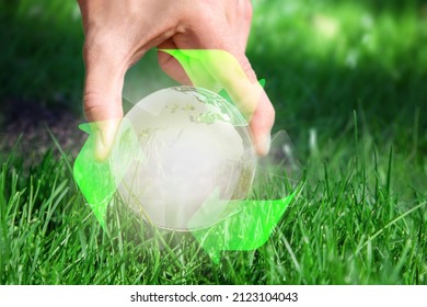 Eliminate Waste And Pollution. Circular Economy Concept. Hand With Globe