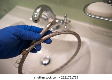 Elimination of leakage of the faucet in the bathroom. Replacement of the mixer hose in the sink. Connection of the water hose. Installation of flexible water supply.