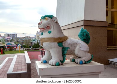 ELISTA, RUSSIA - APRIL 23, 2022: Photo of figure of a snow lion - the guardian of the Teaching at the entrance to the Buddhist temple "Golden Abode of Buddha Shakyamuni".