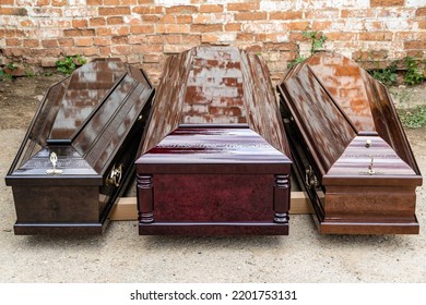 Elite coffins on pallet for transportation. Three types of coffin models made at Elite Grob enterprise.  Kurganinsk. Close-up.Russia 2022 - Shutterstock ID 2201753131