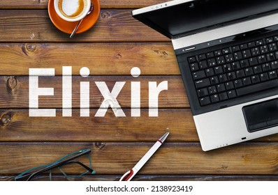 Elixir Programming Language. Word Elixir on wooden desk and laptop
 - Shutterstock ID 2138923419