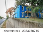 Elizabethtown, Kentucky United States - October 10 2023: a blue historic home on a hill during the autumn season 