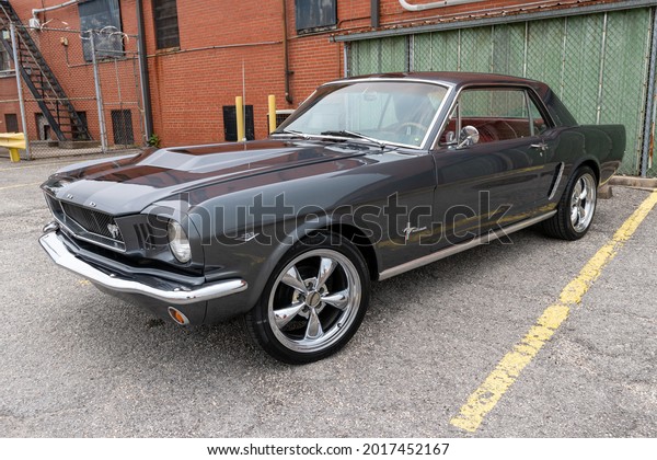Elizabethtown, KY, USA - July 31,\
2021: Black classic Ford Mustang on display during the Cruisin\' The\
Heartland 2021 car show in downtown Elizabethtown,\
KY.