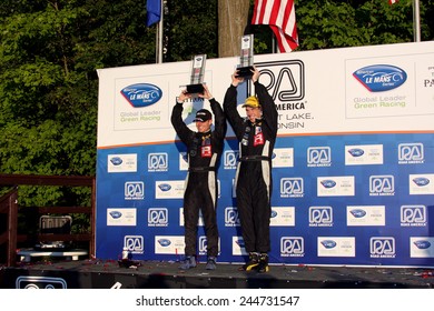 Elkhart Lake Wisconsin, USA - August 18, 2012: Road America Road Race Showcase, ALMS, multi-class sports car and GT motor race. American Le Mans Series Four-hour, timed period. P1 Champions 