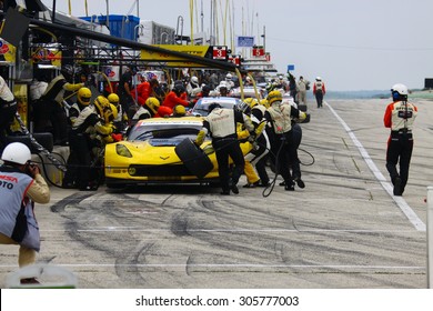 Elkhart Lake, Wisconsin USA - August 9, 2015: Road America road course, IMSA - Corvette racing team cars make tire and fuel pit stop. Corvette C7.R IMSA Tudor GT Le Mans class.